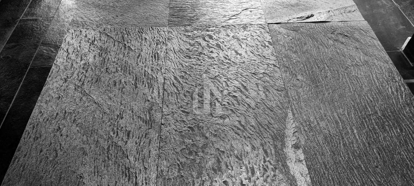 Cosmic Black stone cladding - starlike mineral deposits close-up detail